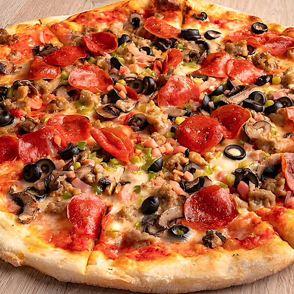 A close-up of a Slice Brunswick pizza with pepperoni, sausage, olives, mushrooms, and peppers.